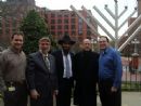 At the Menorah lighting, L-R Dr. Dave Sidransky, Rev. Dr. Scharf, Rabbi Zev Gopin, Dr. Bert Vogelstein, Avi Lopin