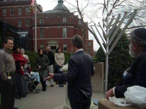First-ever Public Menorah lighting at Johns Hopkins Hospital. Rev. Dr. Uwe Scharf, Dir. of JHH Dept. of Pastoral Care, addresses the crowd.