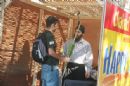 Helping a student shake the lulav and etrog.